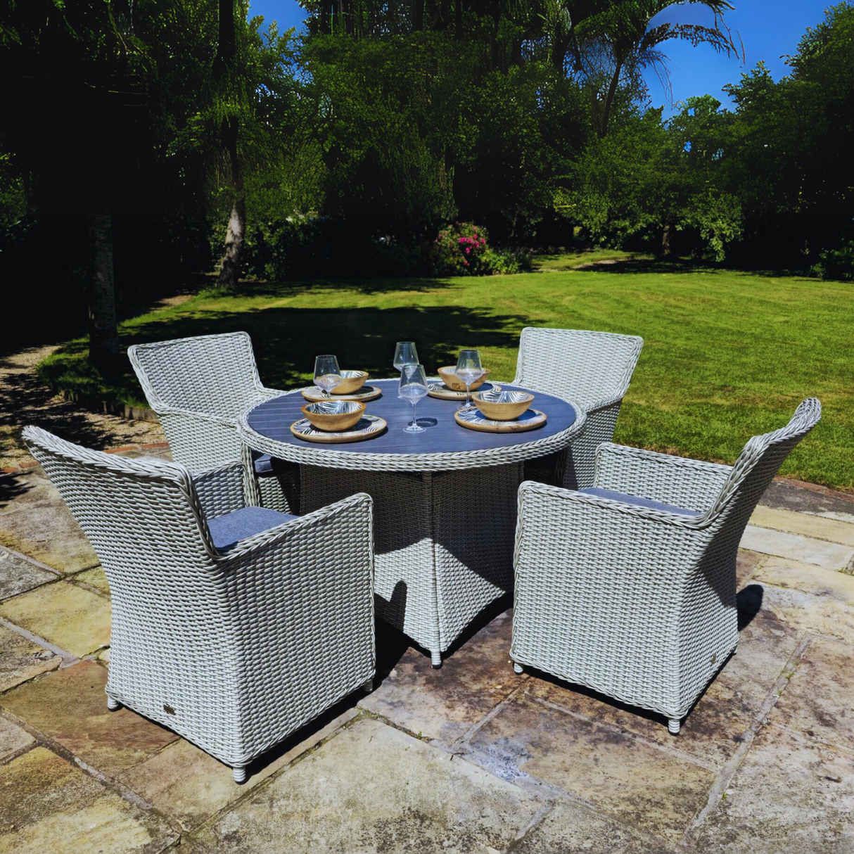 Dublin Deluxe 4 Seater Round Dining Set with a round table and four chairs.